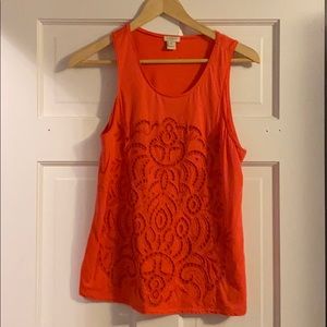 Orange/red/coral-ish tank with cutout details